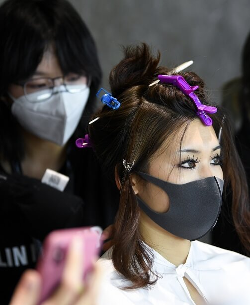 Stylist and Model in Masks at China Fashion Week 2020s